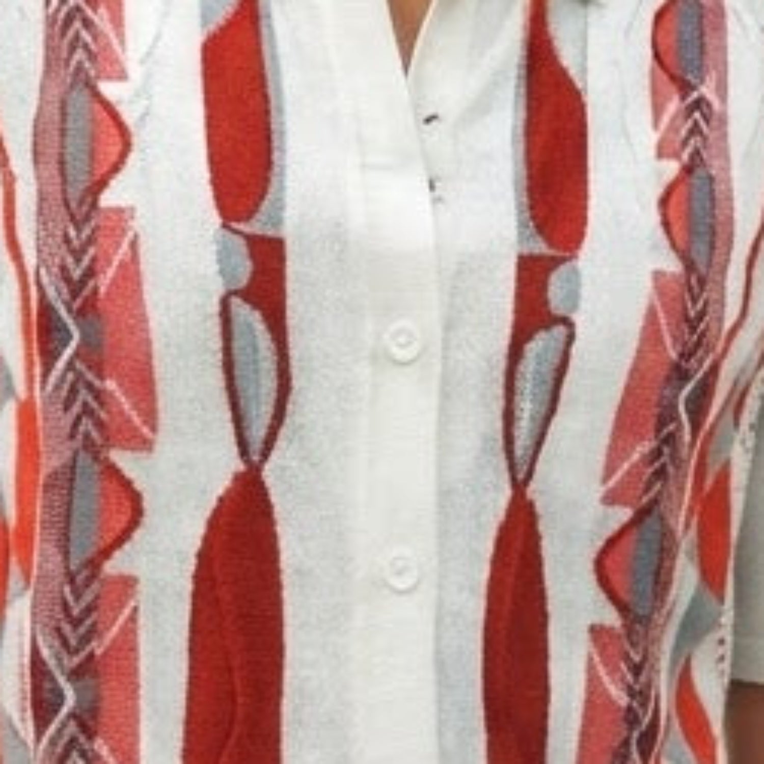 Close-up of Stacy Adams walking suit shirt showing the red geometric knit texture and button details