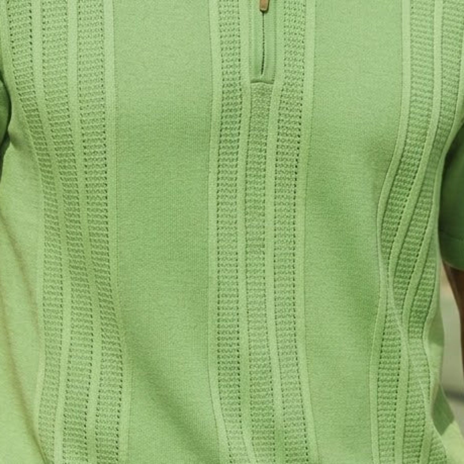 Close-up of the sage green Stacy Adams knit polo showing the vertical textured pattern and metallic zip hardware