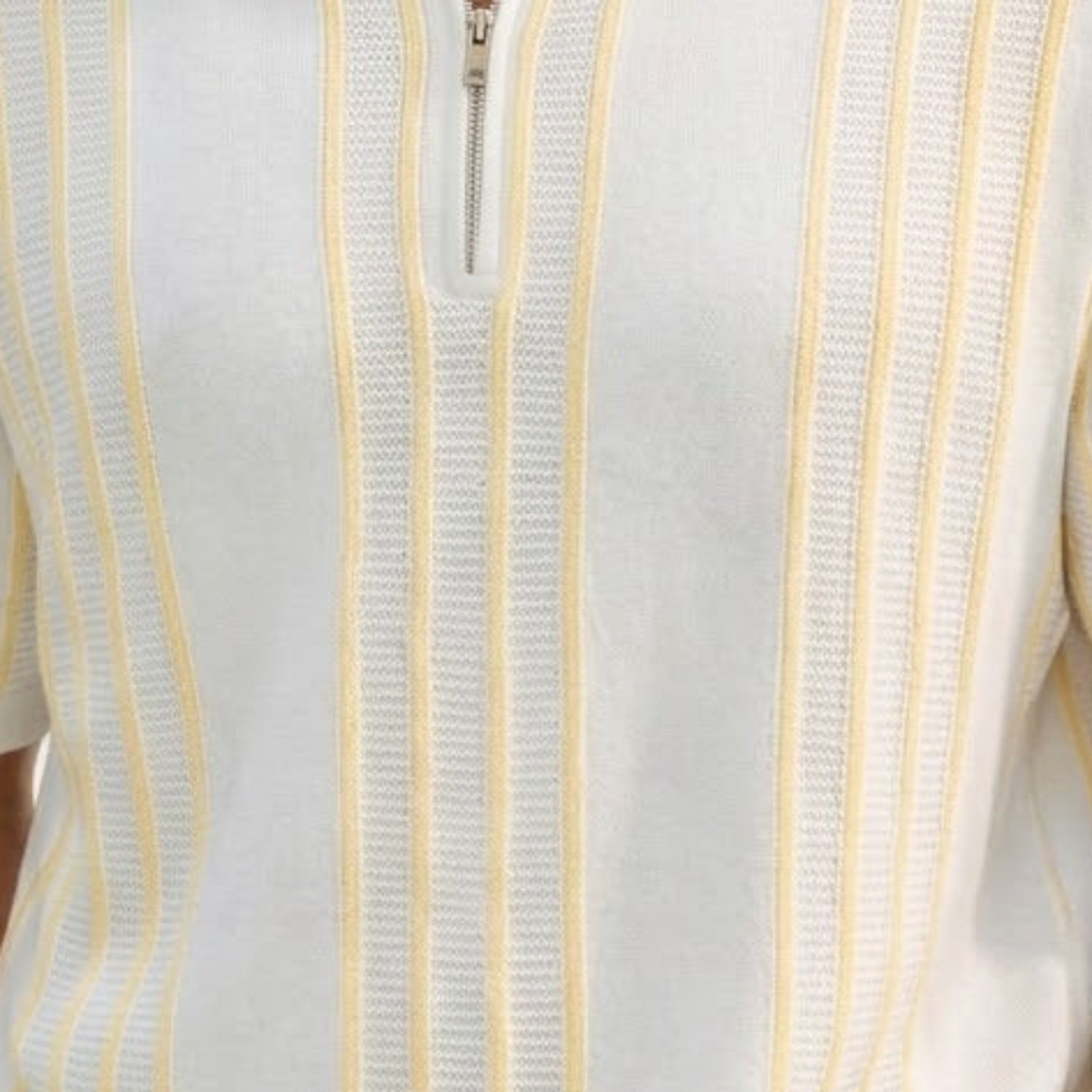 Close-up of the white Stacy Adams knit polo showing the vertical textured pattern and metallic zip hardware