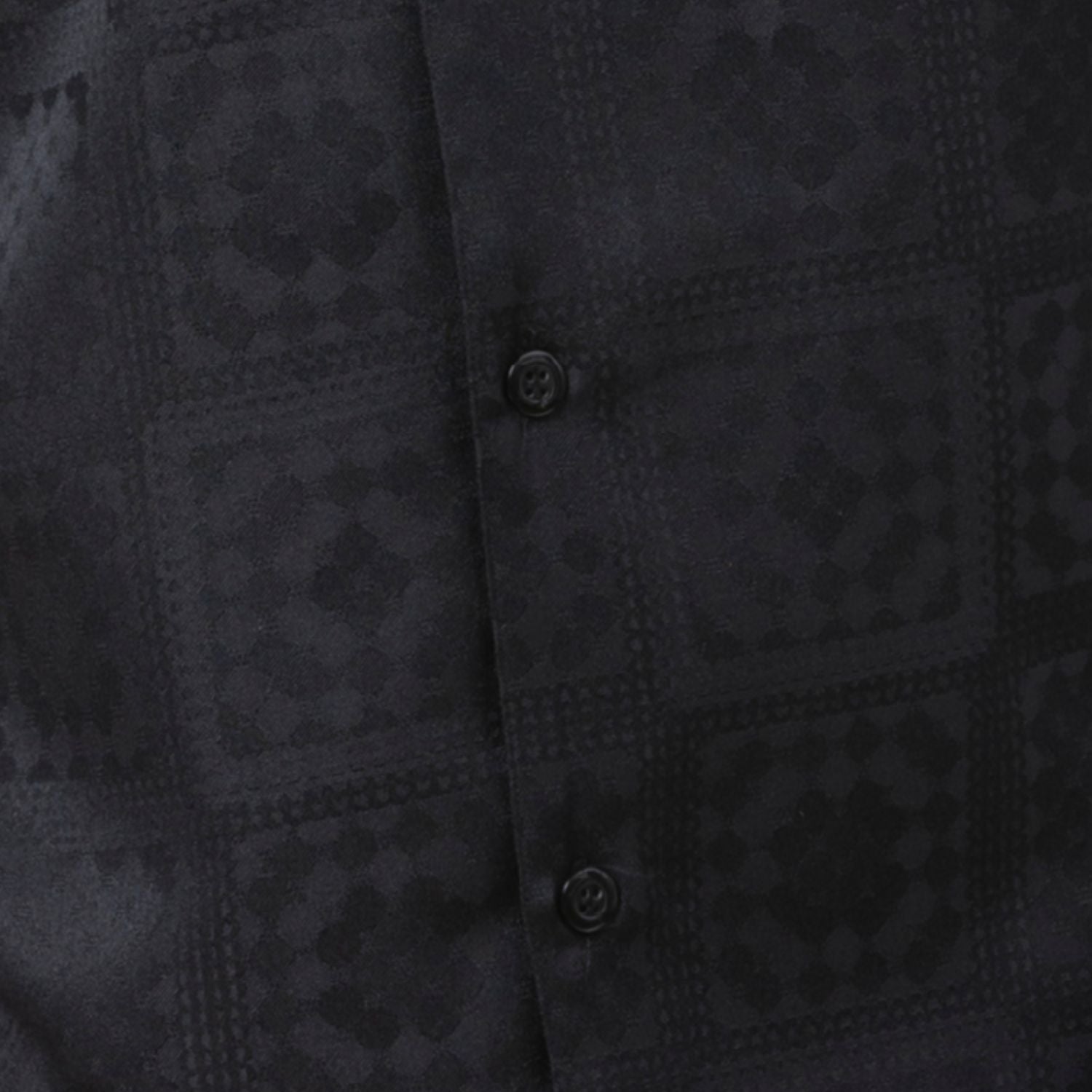 Close up of the black tonal check walking suit with short sleeve shirt and matching pants