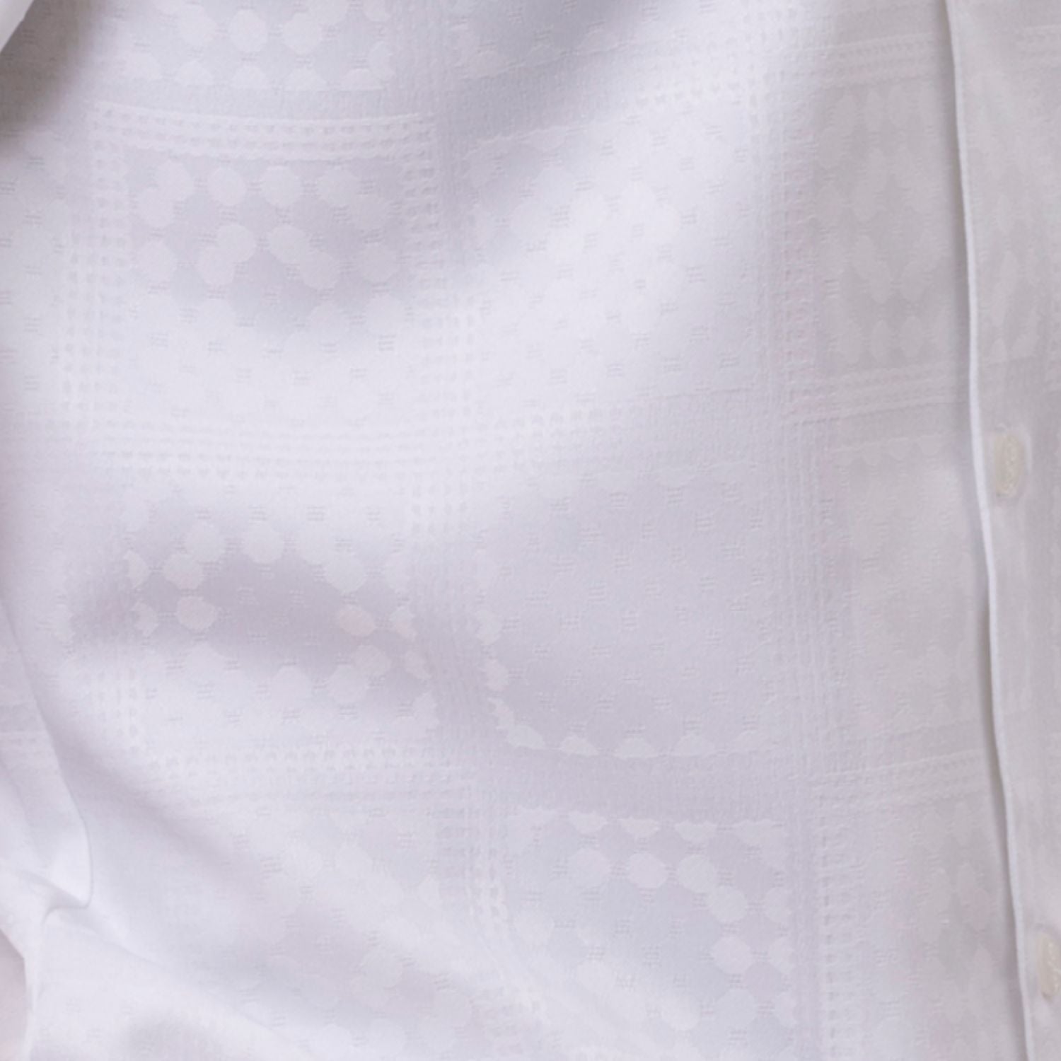 Close up of the white tonal check walking suit with short sleeve shirt and matching pants