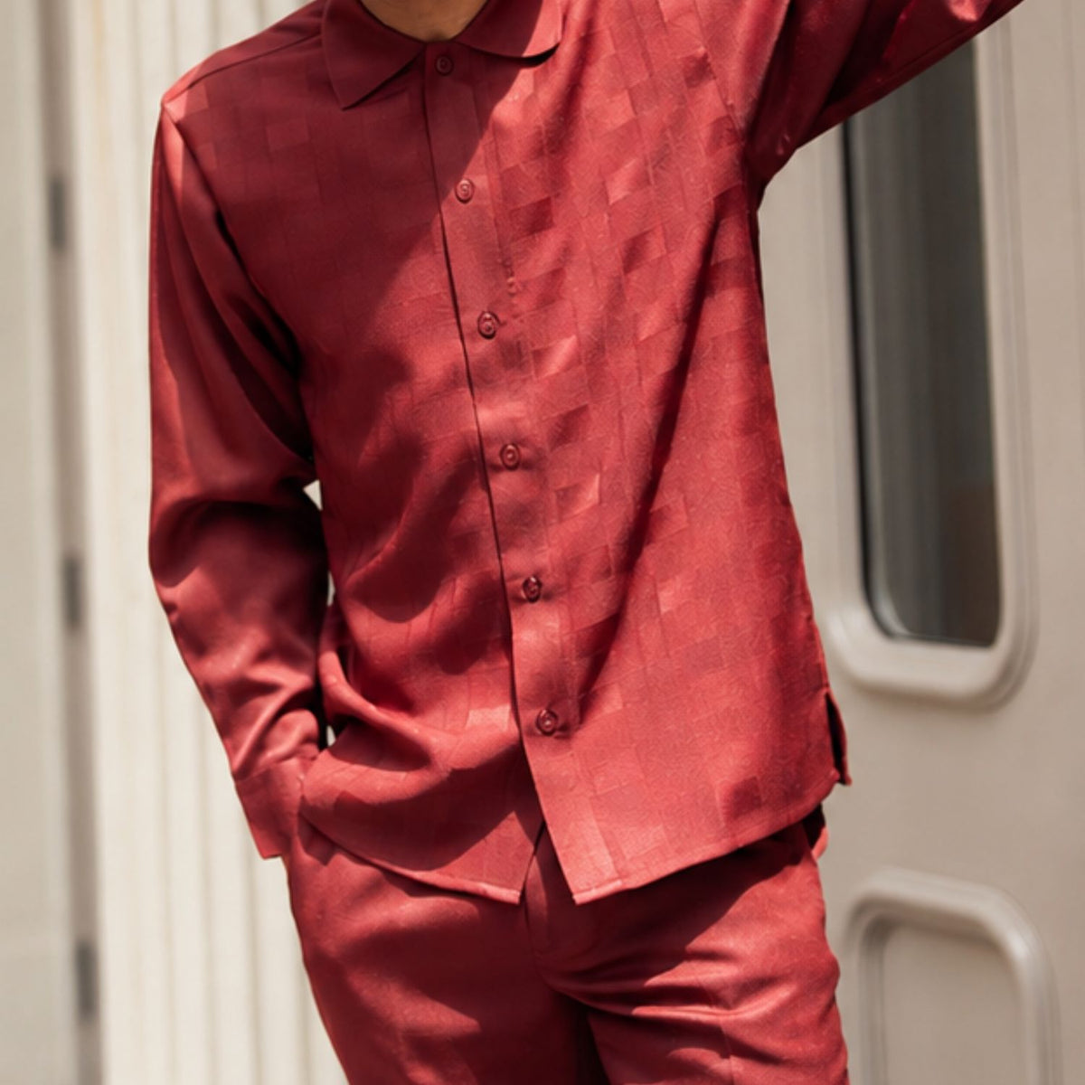 Close-up of wine tone-on-tone block pattern long sleeve walking suit by Montique