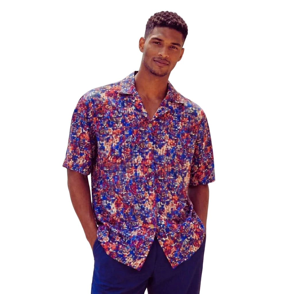 Blue men's short-sleeve shirt with a multi-colored abstract print and open camp collar.