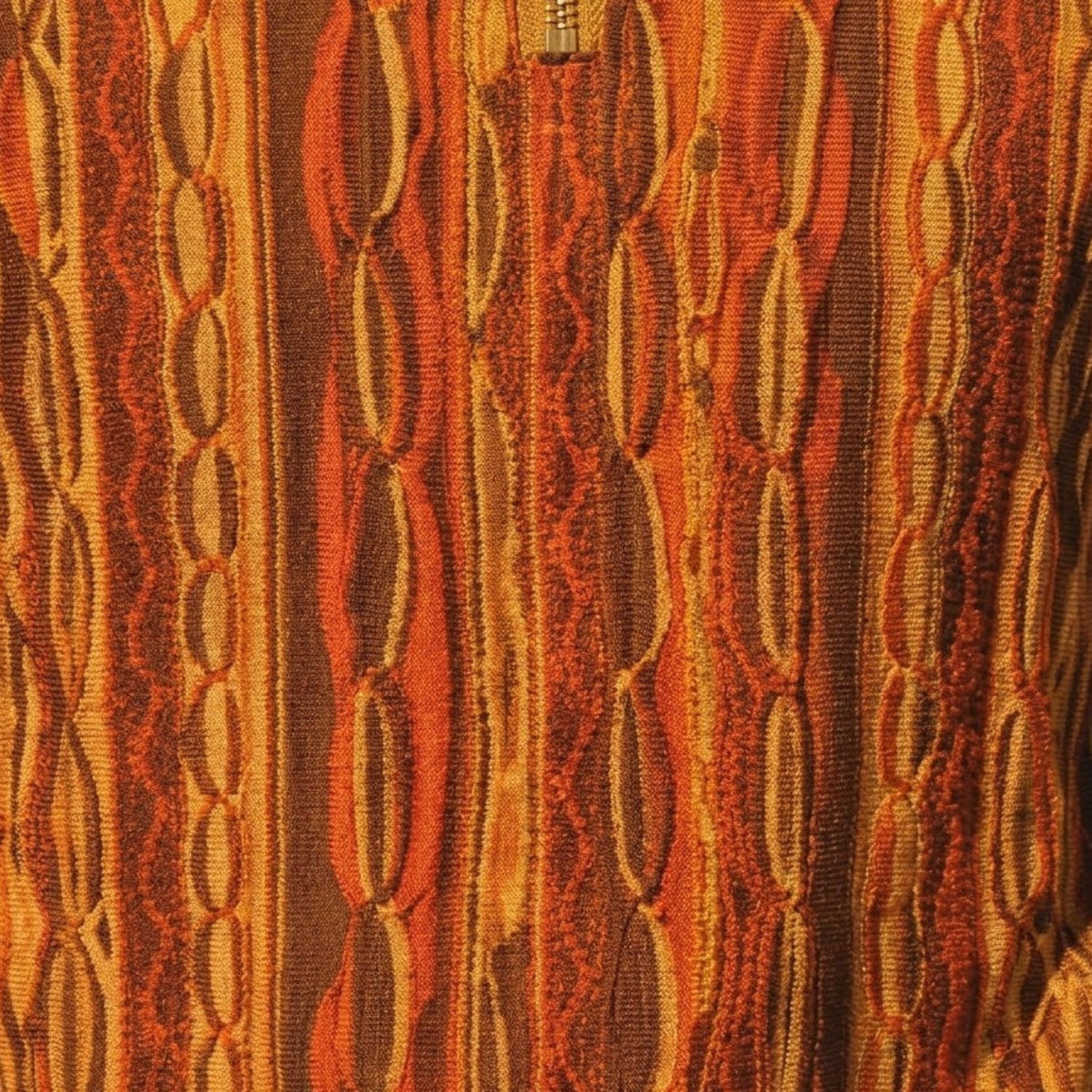 Close-up of brown wavy textured knit walking suit shorts set fabric detail