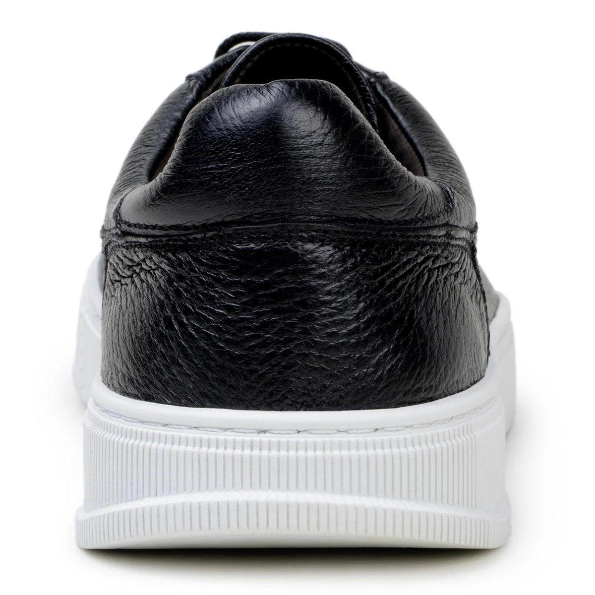 Back view of black low-top leather sneaker