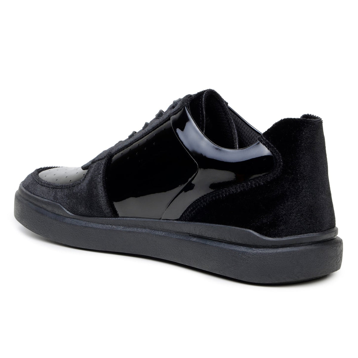 Rear three-quarter view of black Edmound sneaker showing panel construction