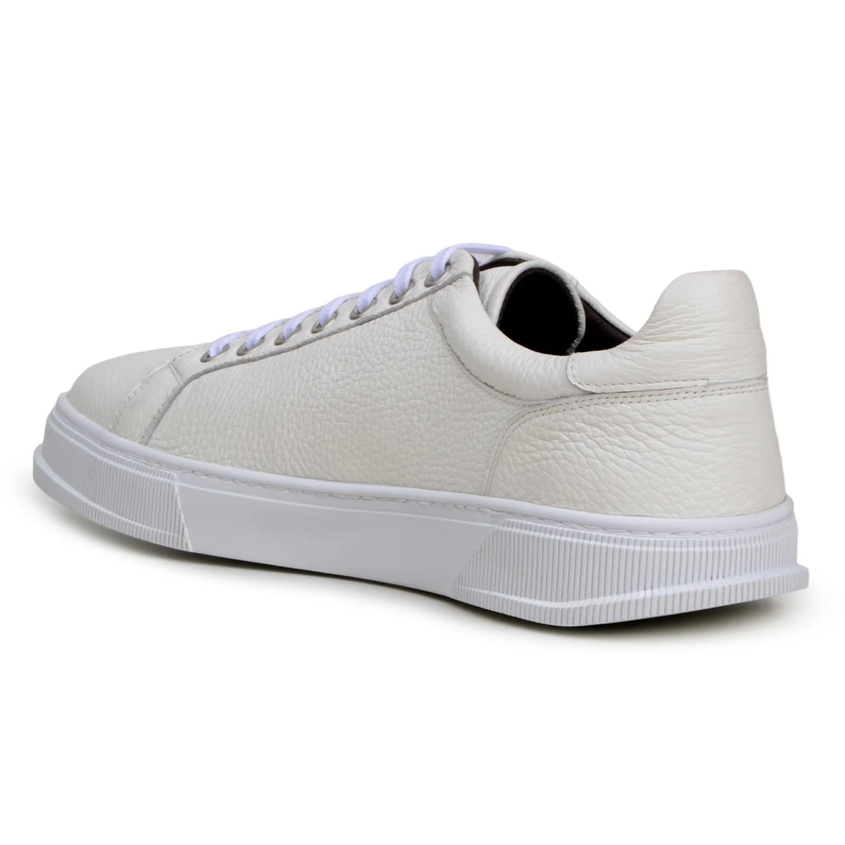 Angled view of white deerskin loafer with silver-tone bit