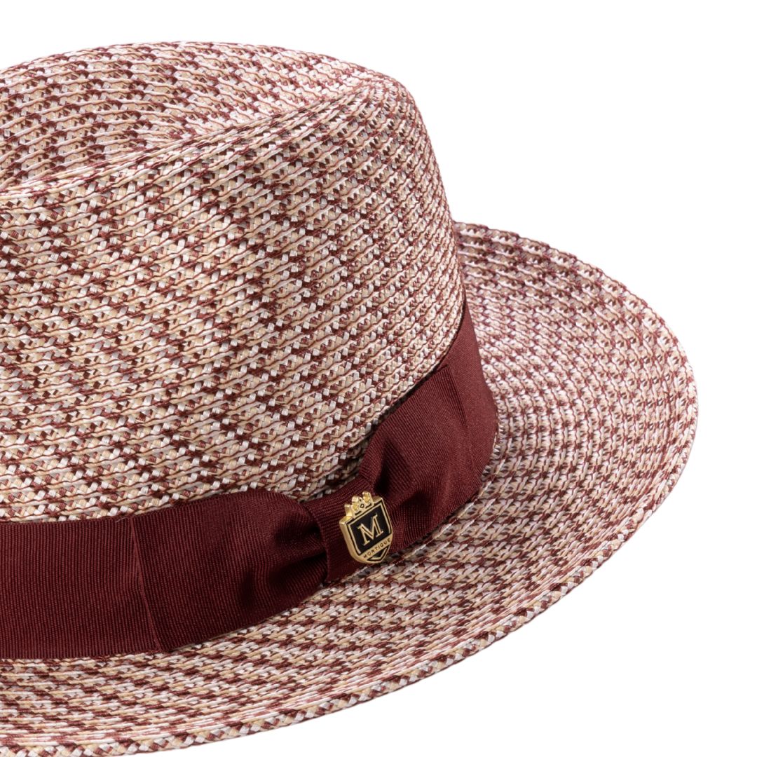 Close-up grosgrain ribbon and crest pin detail on fedora hat