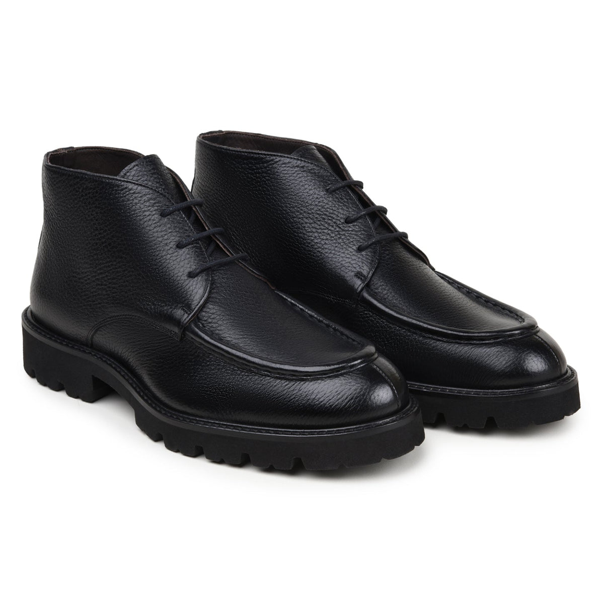 Pair of black hornback and calfskin chukka boots