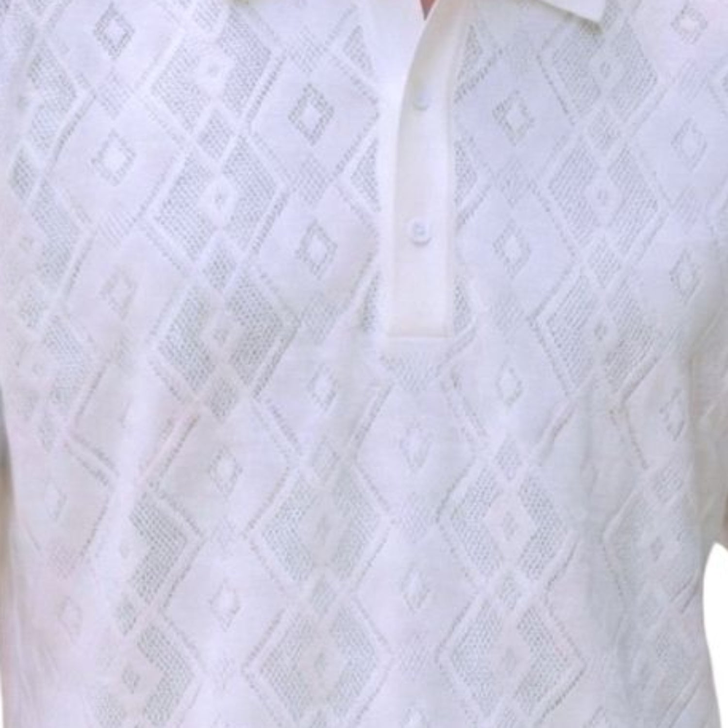 Close-up of the white textured knit fabric highlighting the diamond motif and buttons