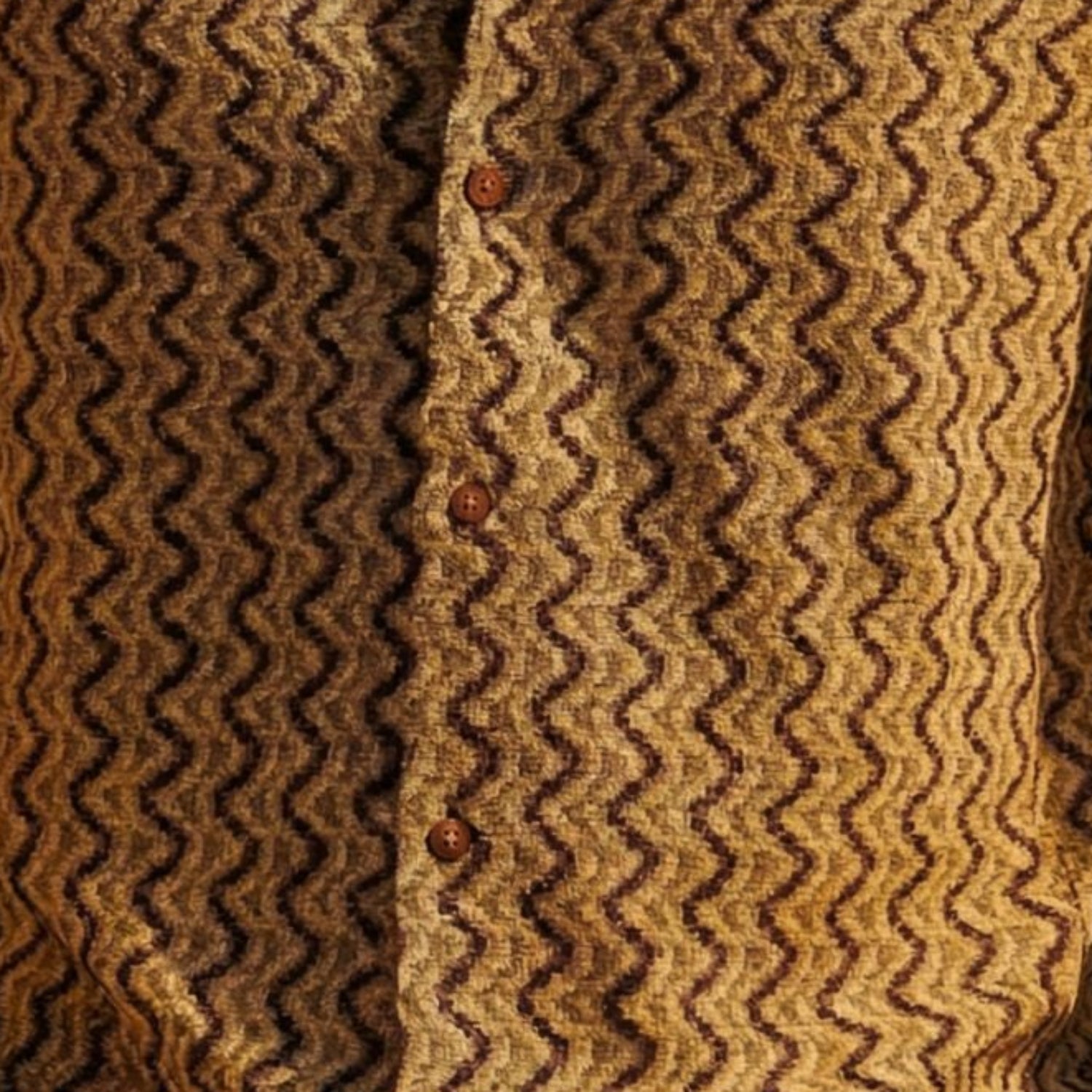 Close-up of brown textured geometric knit fabric on Stacy Adams short sleeve shirt