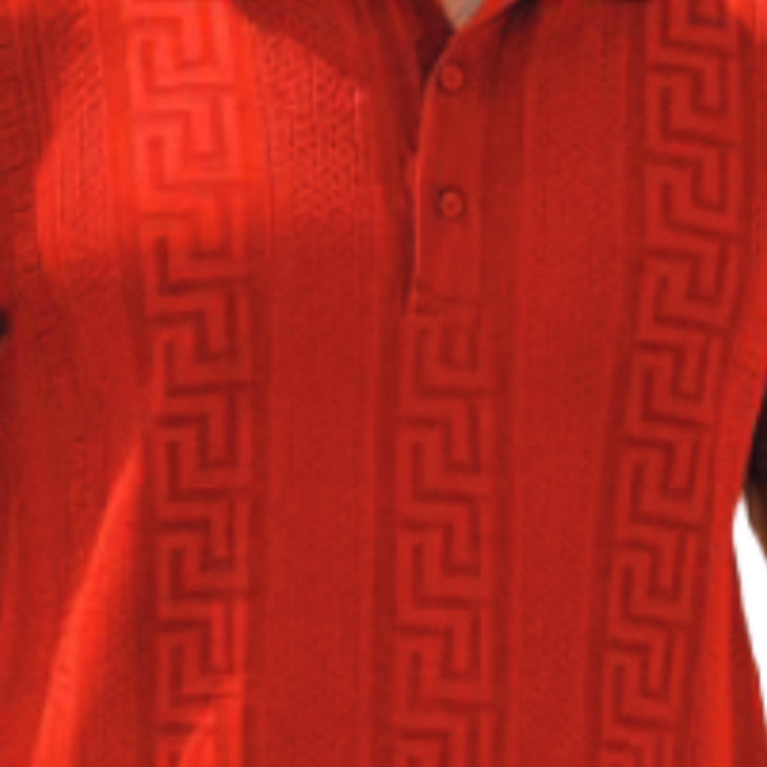 Red textured knit polo shirt detail showing the structured collar and three-button placket.