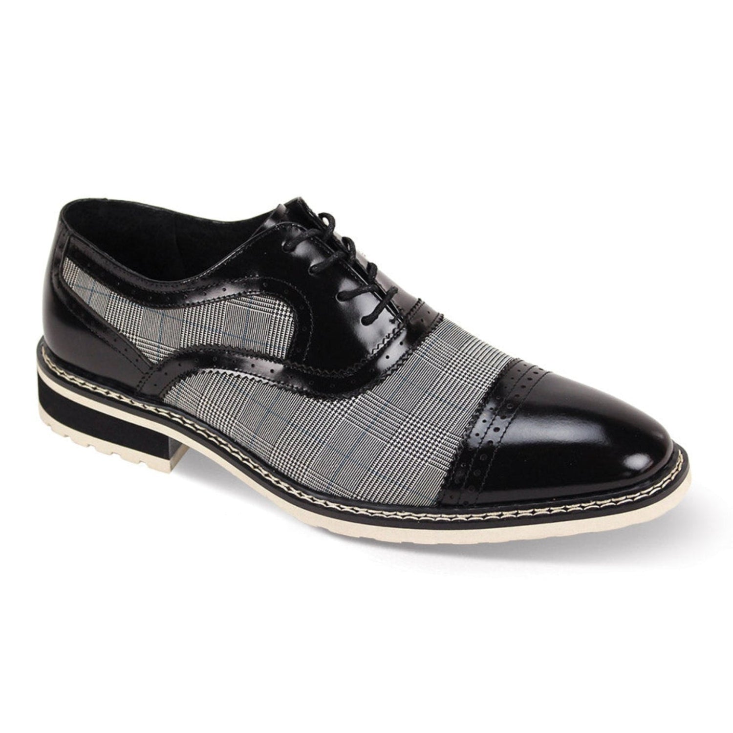 Black and white leather and tweed cap-toe lace-up shoe side profile view.
