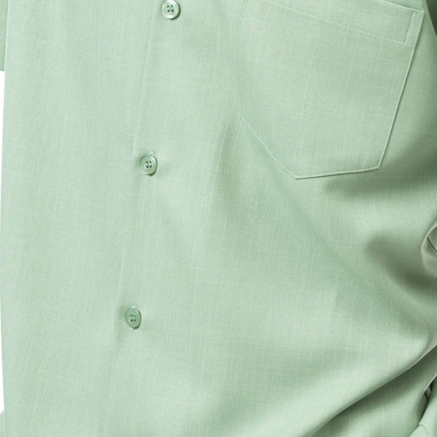 Close-up of apple 100% polyester fabric showing the solid texture and button detail