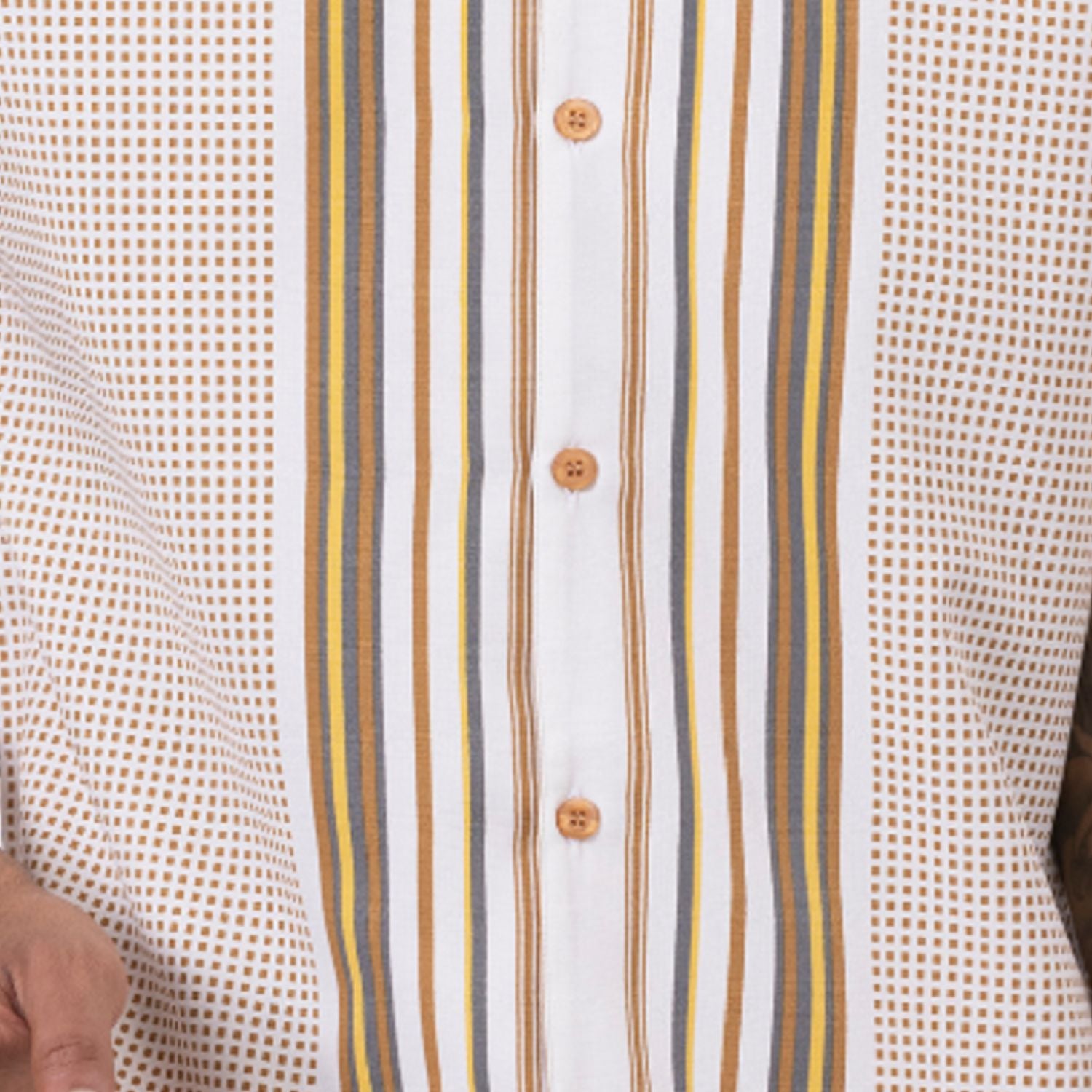 Cloe up of the Cognac geometric symmetry pattern short sleeve walking suit set with cuffed shorts