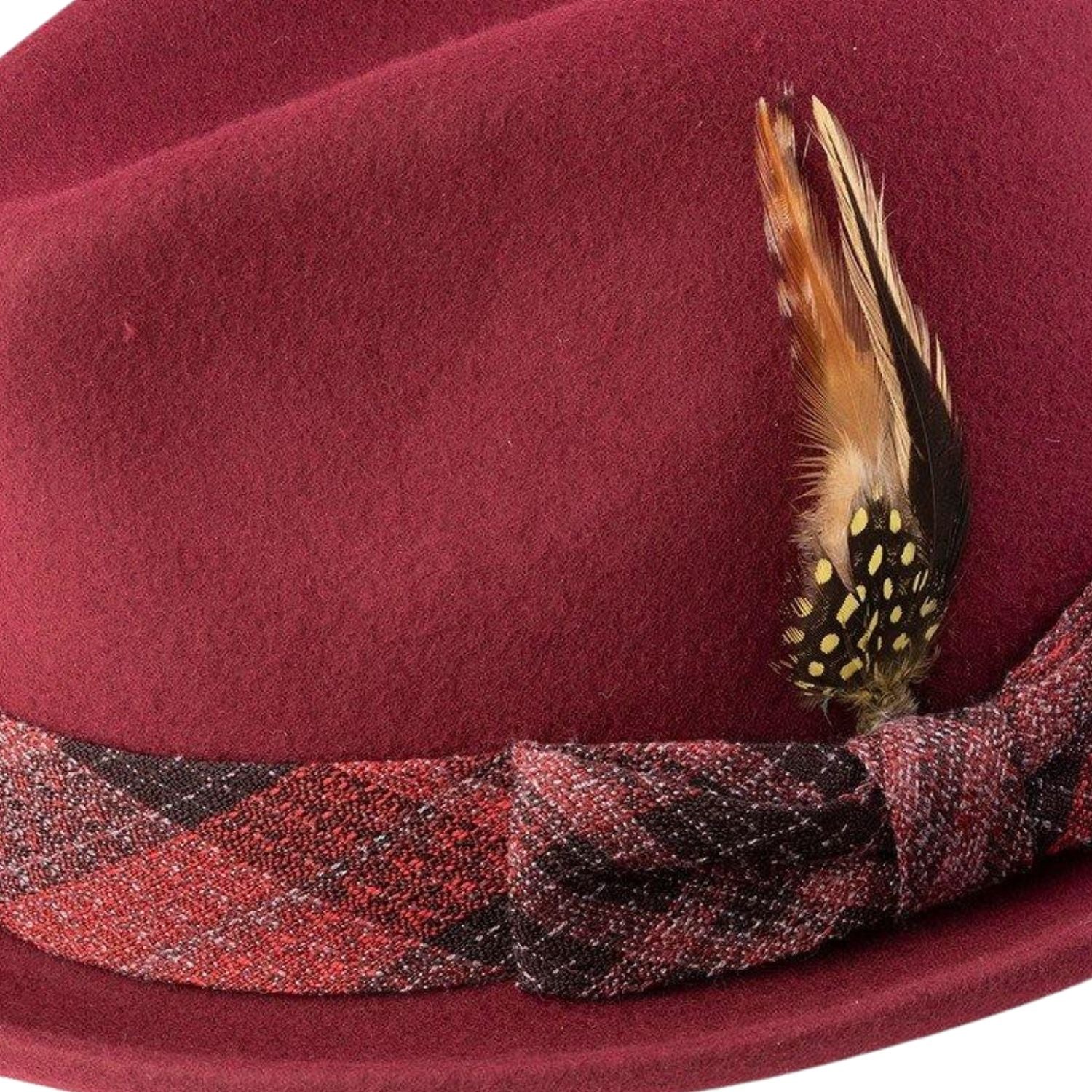 close up side view of brick felt pinch hat with feather detail