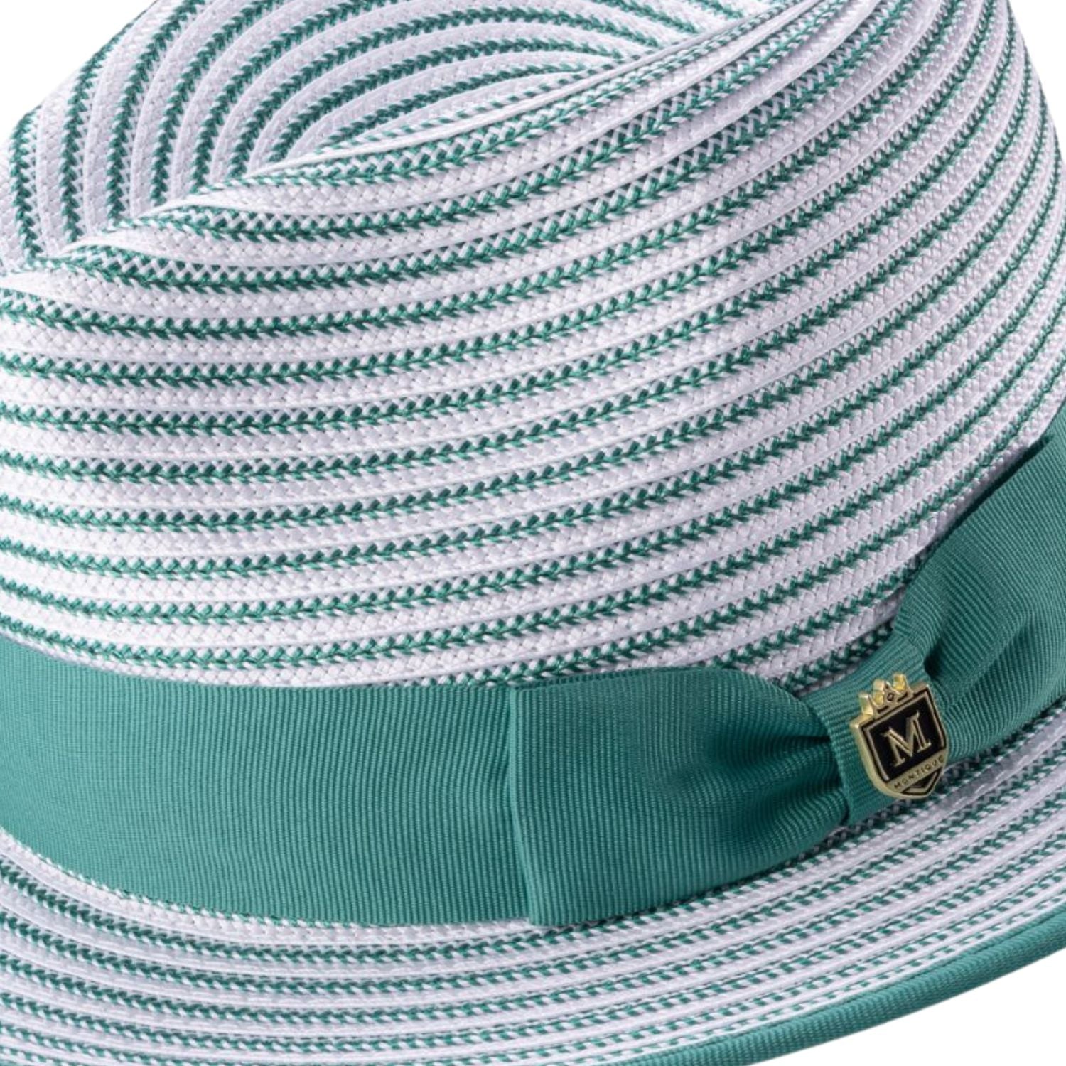 Close-up of the emerald striped fabric texture and the signature Montique metal pin on the ribbon band.