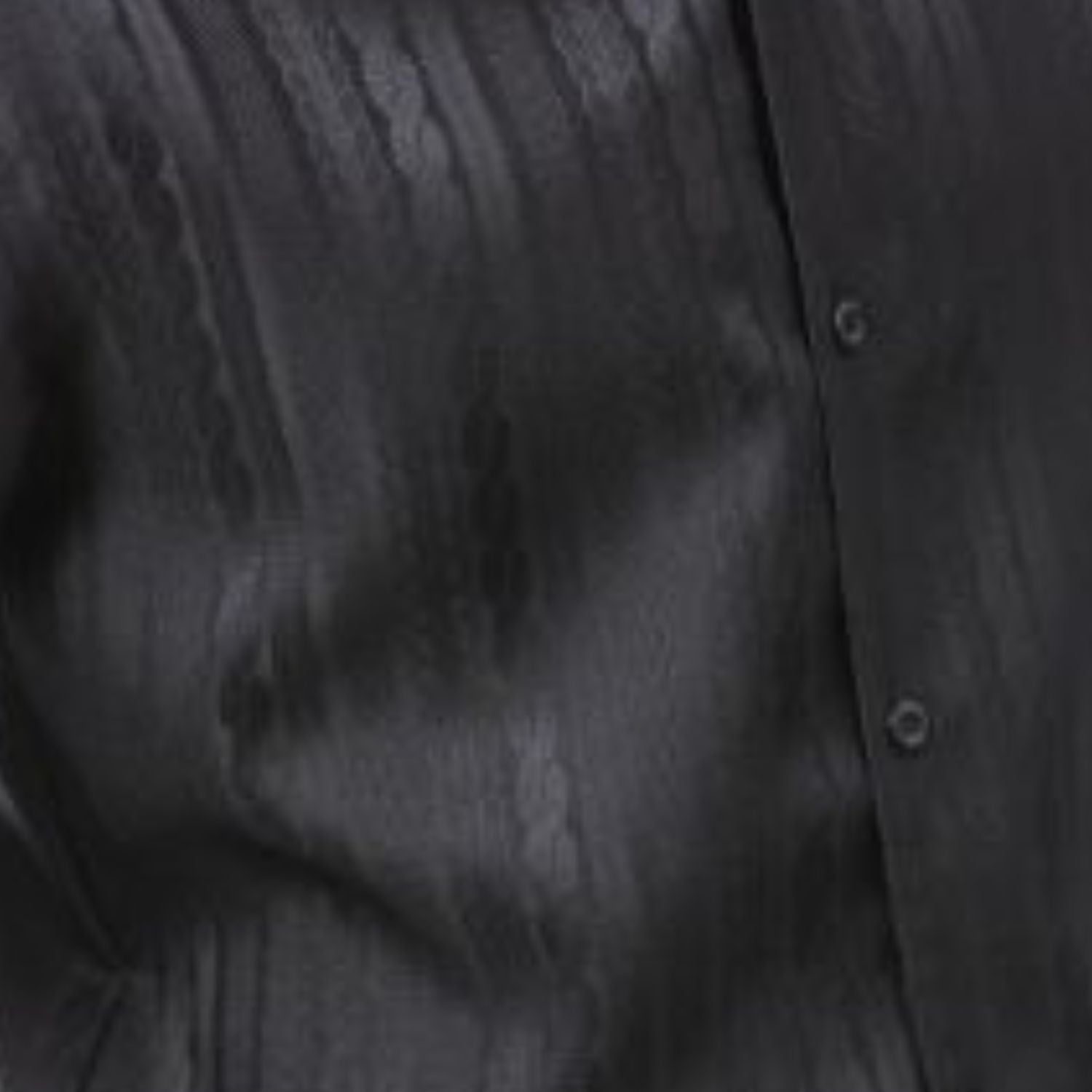 Black tone-on-tone cable knit men's walking suit shirt close-up showing textured pattern