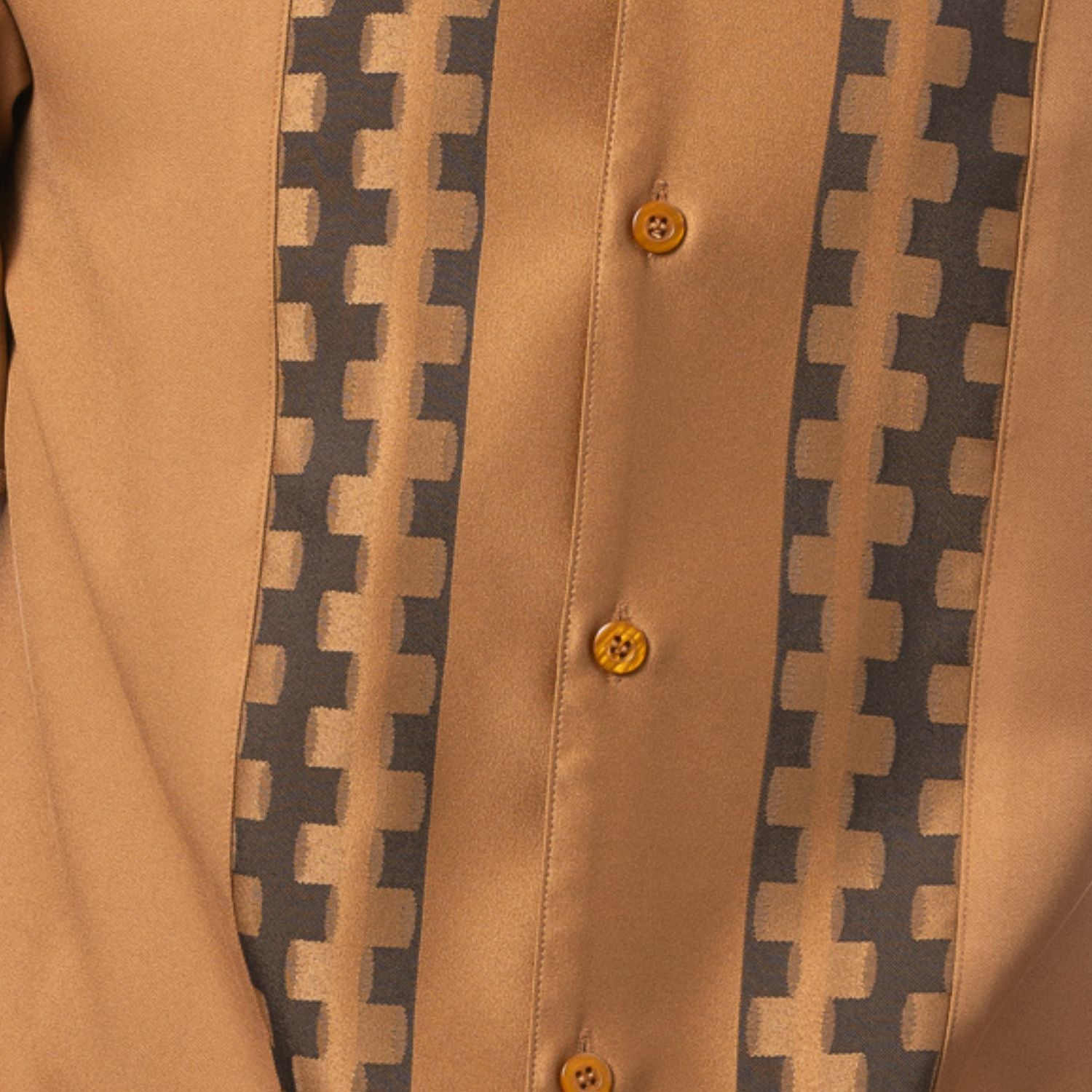 Close-up of cappuccino walking suit shirt showing the tonal contrast block panels and cuff trim detail.