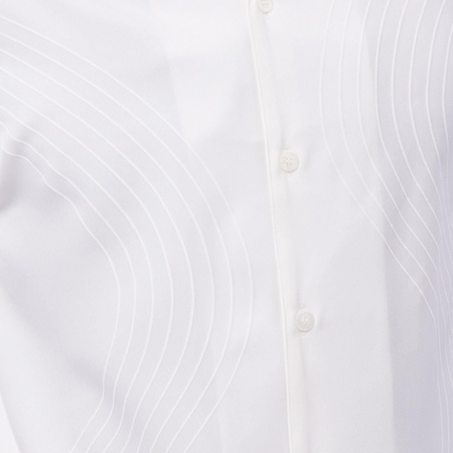 Close-up of cream walking suit shirt showing the detailed tonal multi-row puff stitched curved lines.