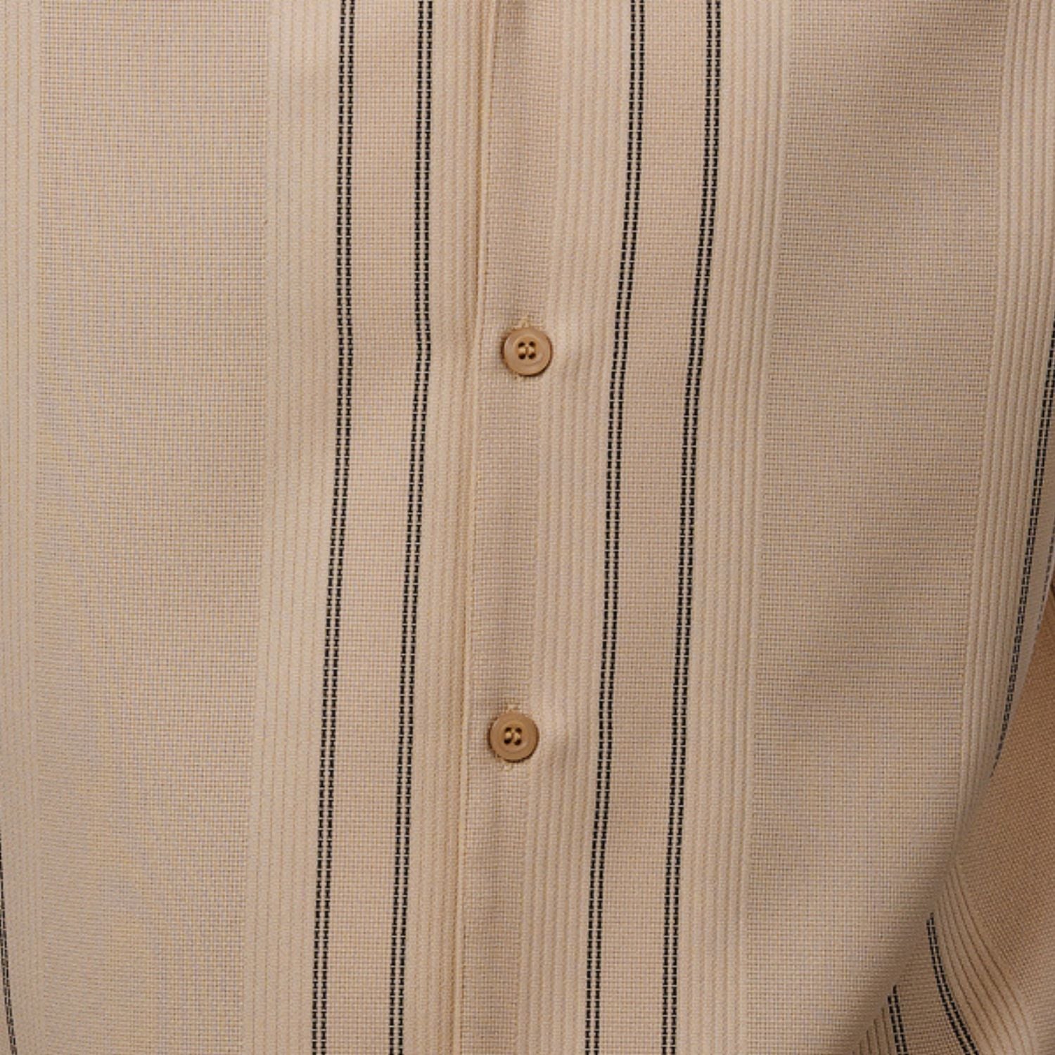 Close-up of beige walking suit shirt showing the detailed textured micro-grid and vertical line paneling.