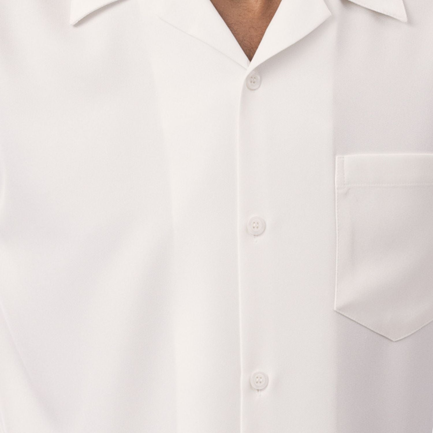 Close-up of cream solid walking suit shirt showing the open collar and clean button-front design.