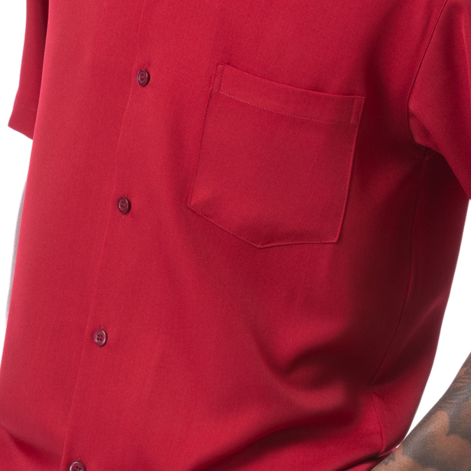 Close-up of red solid walking suit shirt showing the open collar and clean button-front design.