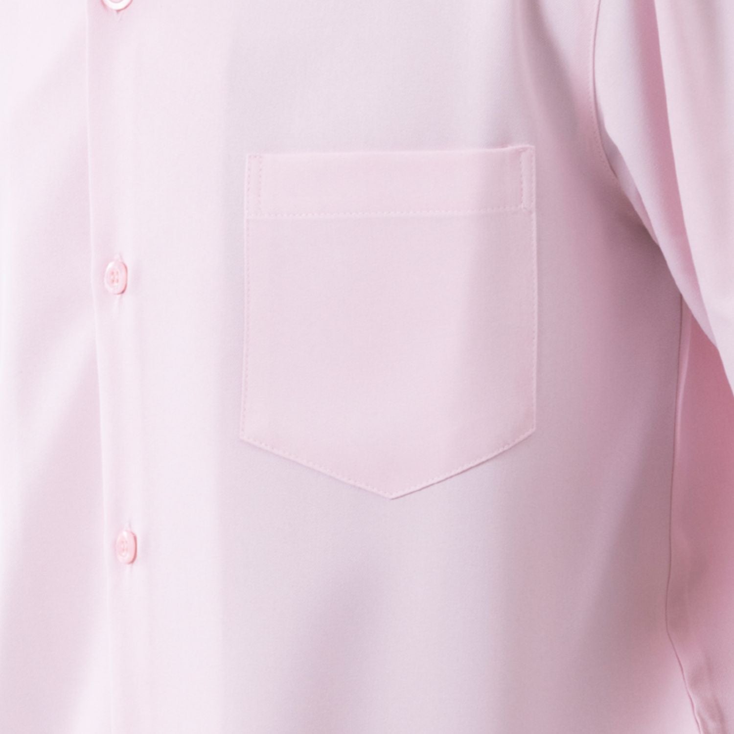 Close-up of pink 100% polyester fabric showing the solid texture and button detail
