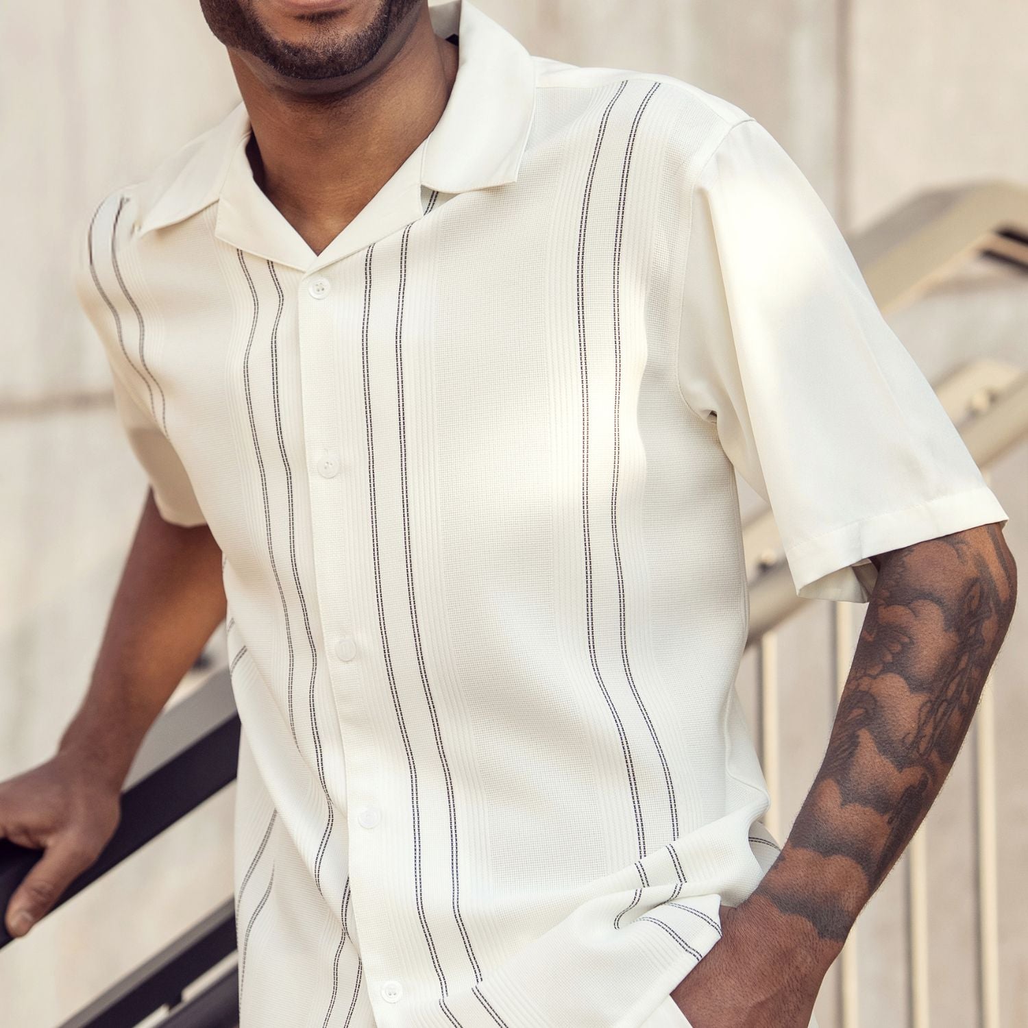 Front profile of the beige textured short sleeve shirt showing the regular fit and straight hem.
