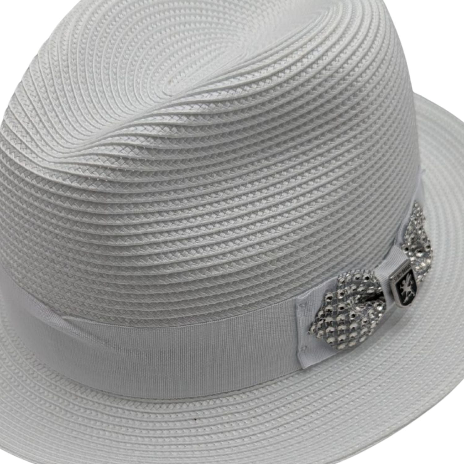 Close up profile of the Scala Spire Collection white fedora showing the 2 1/4" snap brim and rhinestone buckle detail.