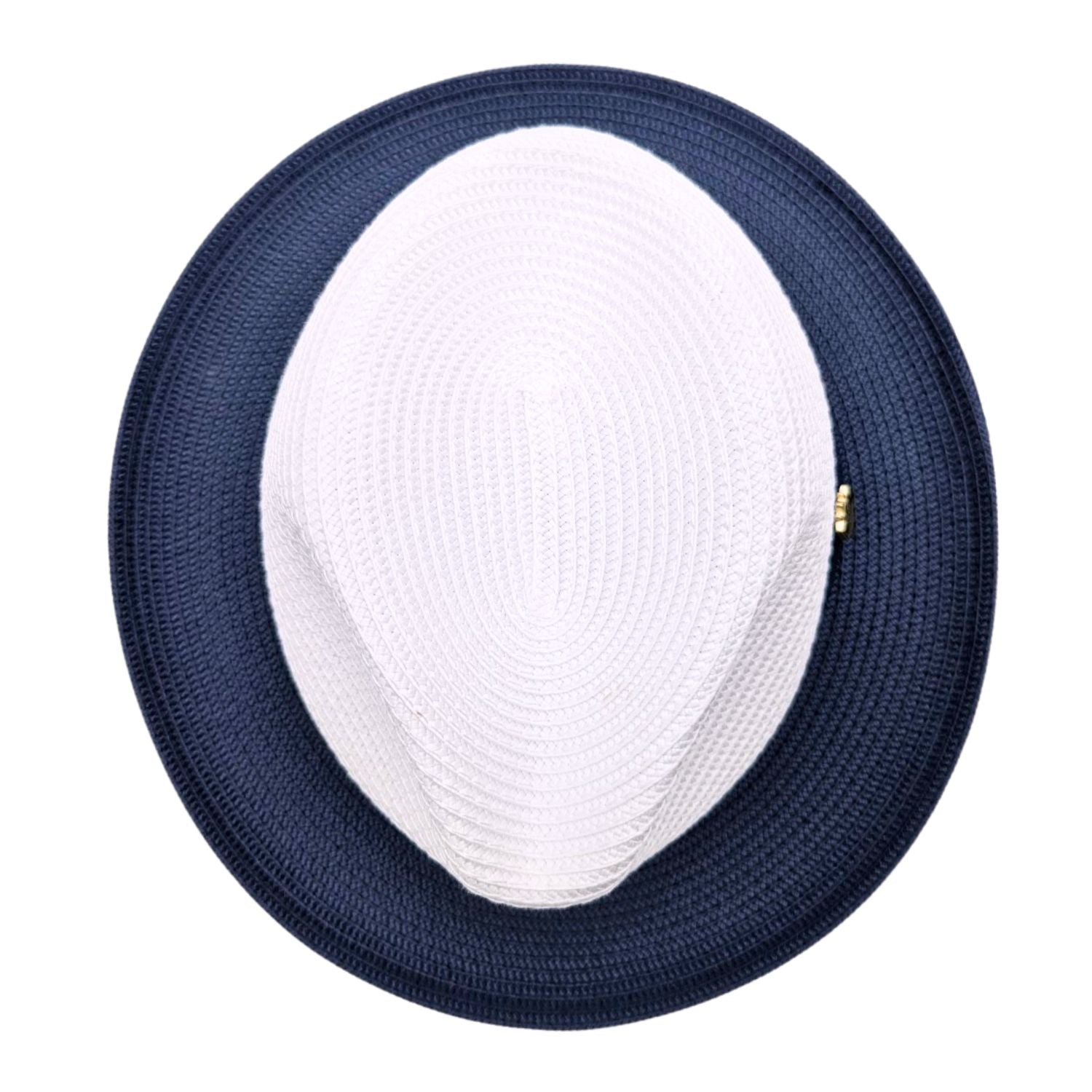 Navy and white Montique fedora hat top view showing white woven crown, navy wide brim, and structured straw-style texture