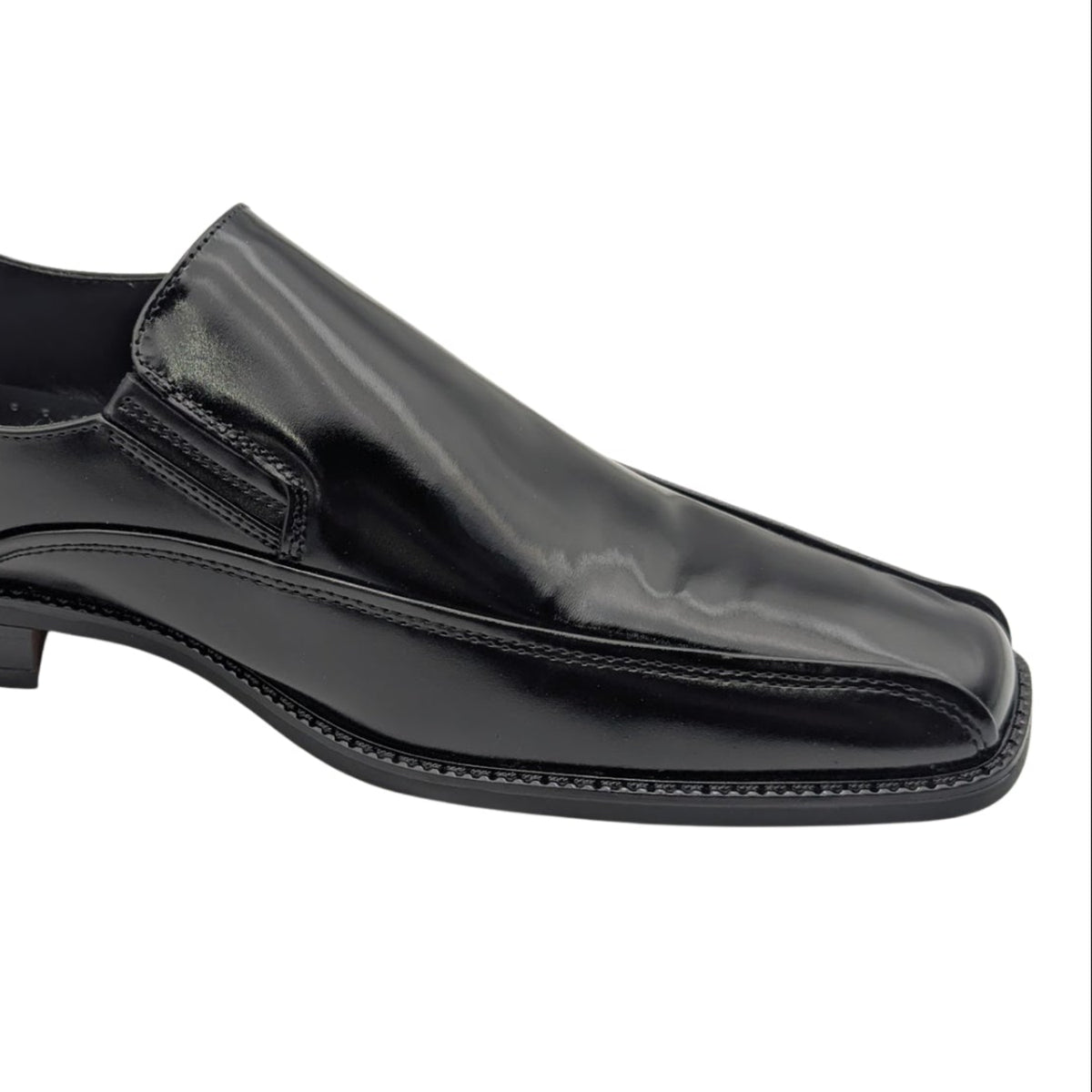 black polished slip-on dress shoe side view close up
