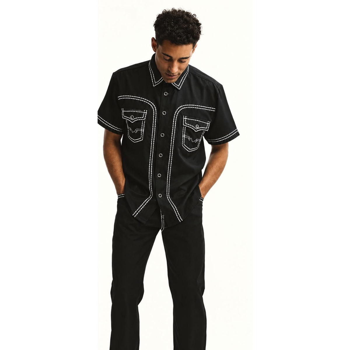 black short sleeve walking suit with embroidered fabric design and contrast stitching front view