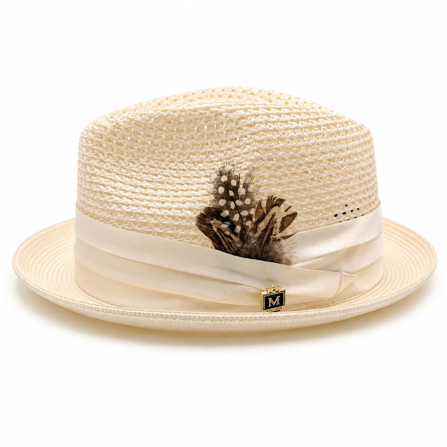 Montique ivory vented straw fedora hat side view with feather accent and logo pin