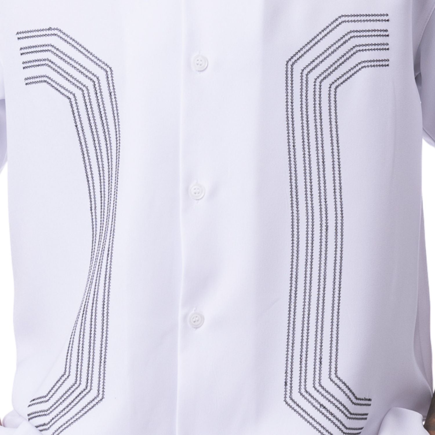 Close up of embroidered panel detail on white walking suit shirt