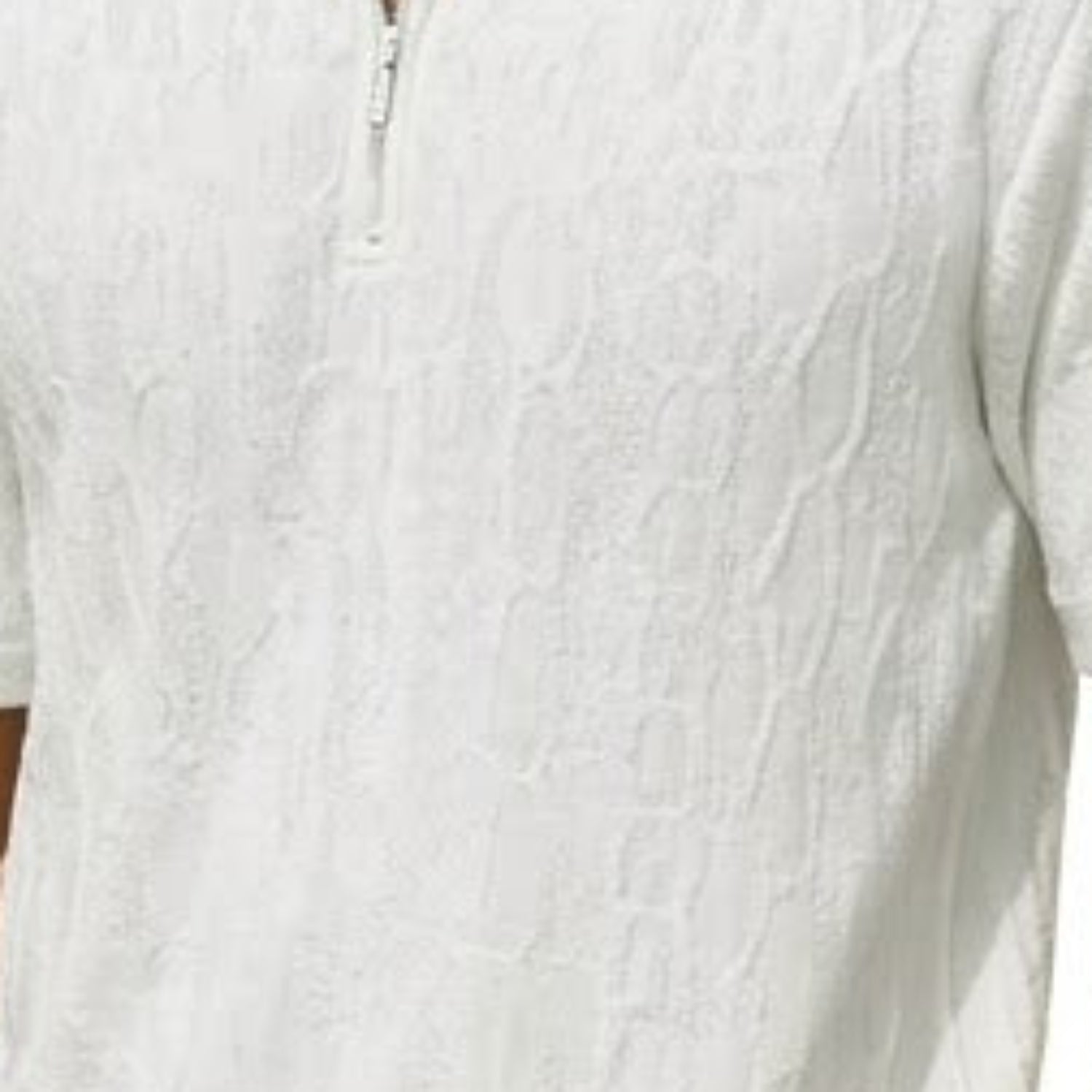 Close-up of white wavy textured knit walking suit shorts set fabric detail