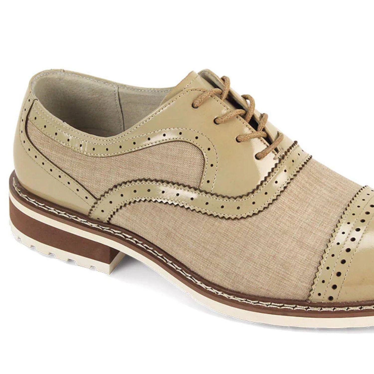 Close-up of Oyster leather brogue detailing and textured light-toned tweed fabric.