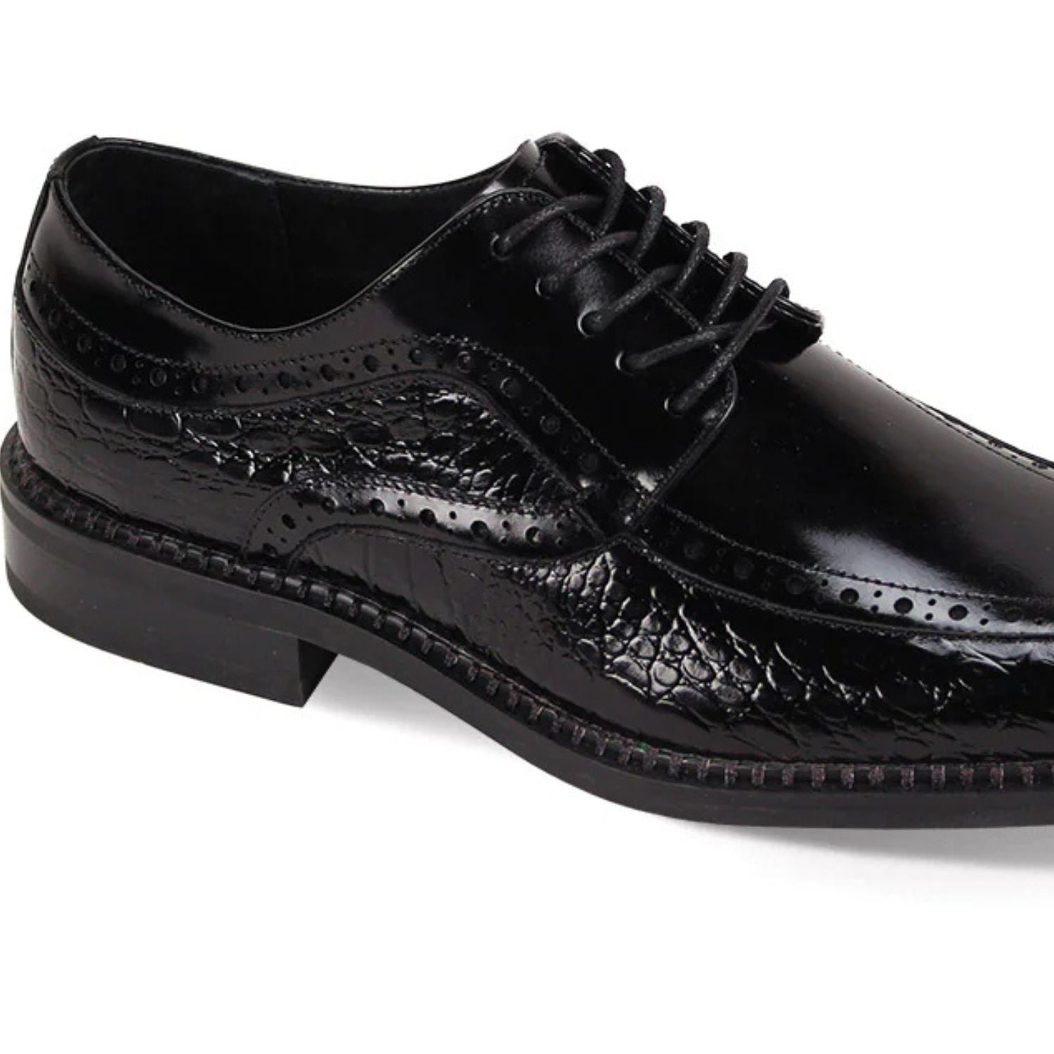Close-up of black leather dress shoe showcasing coco print texture and moc toe construction