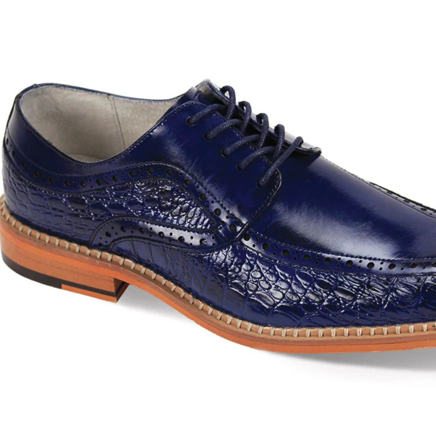 Close-up of cobalt blue embossed coco-print leather texture and moc-toe stitching detail