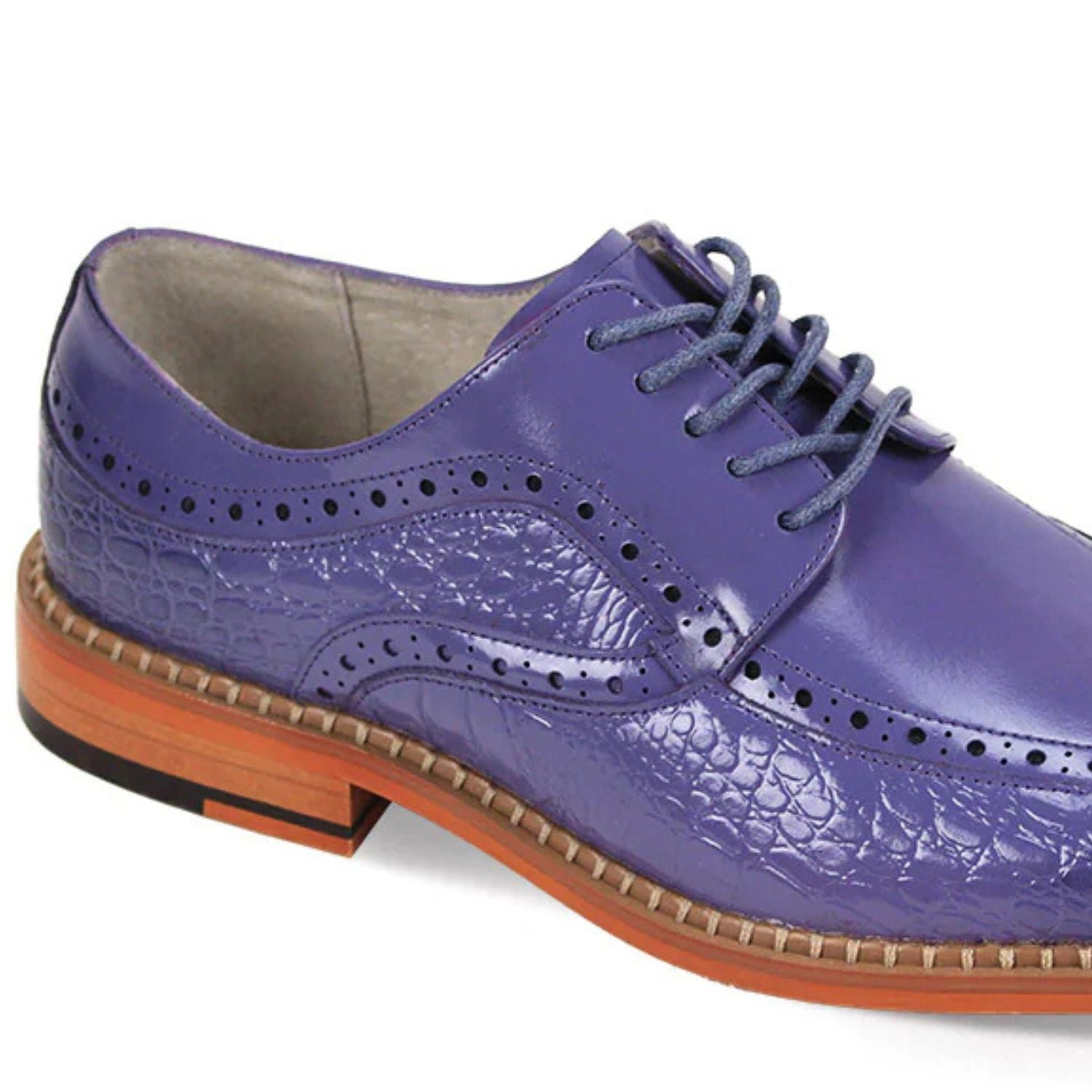 Close-up of lavender embossed coco-print leather texture and moc-toe stitching detail.
