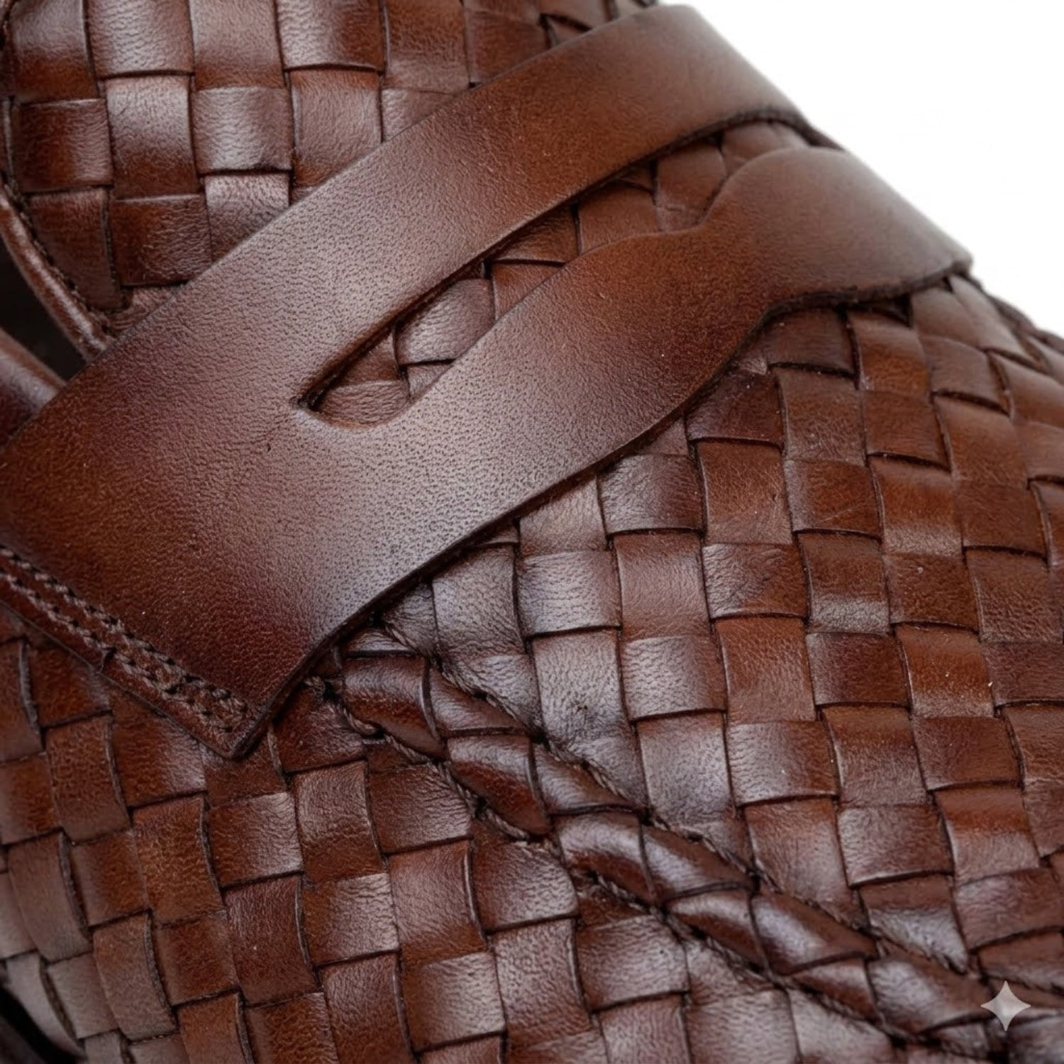 Close-up of the antique tan handwoven calfskin penny loafers