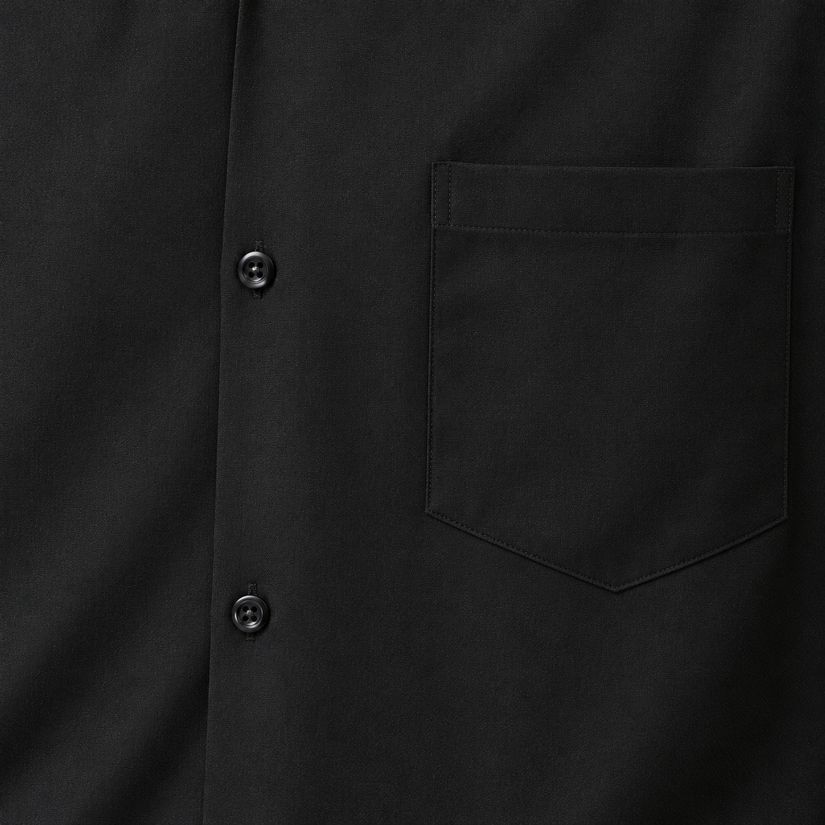 Montique black solid walking suit shirt chest pocket and front button close-up.
