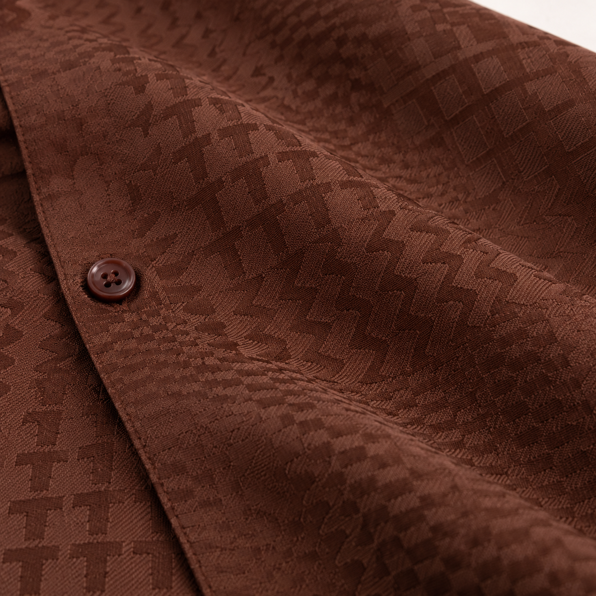 Montique brown tone on tone walking suit tonal fabric sculptural folds
