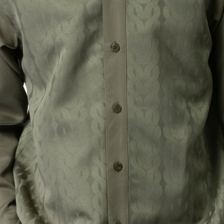 Olive Montique walking suit shirt close-up showing the tonal chain pattern and button front