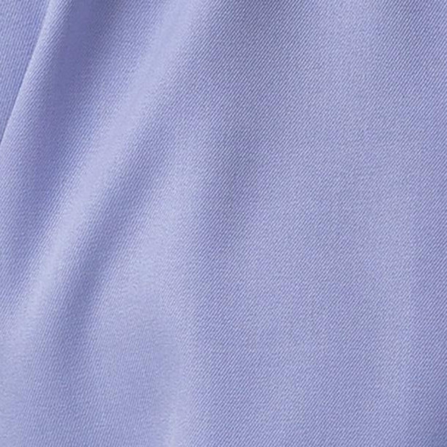 Close-up of lavender 100% polyester fabric showing the solid texture and button detail