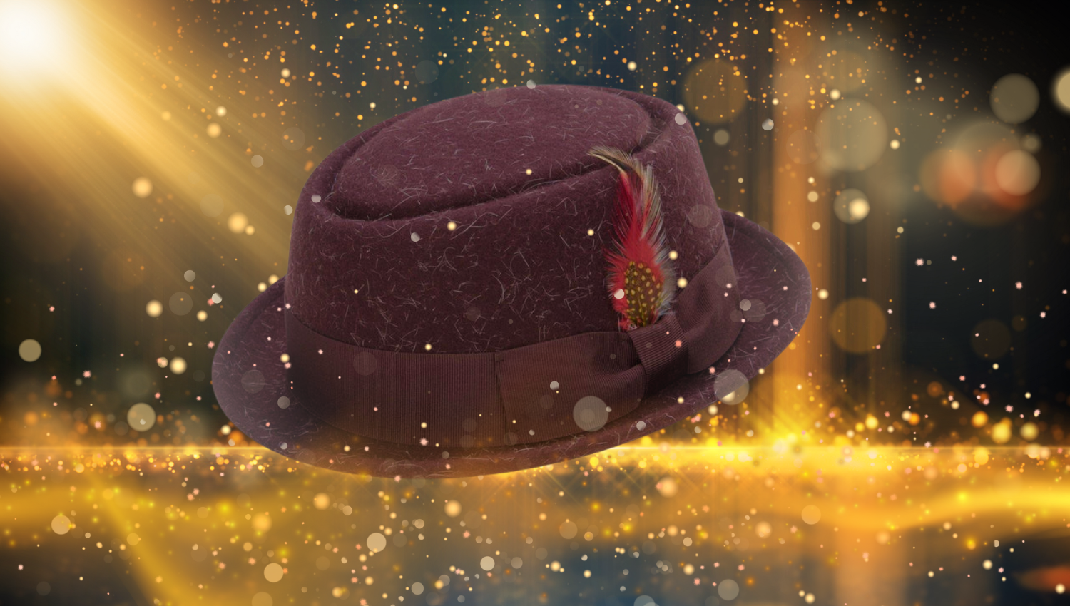 A burgundy pork pie hat with a feather decoration is displayed against a sparkling background with golden lights. The scene has a festive, magical atmosphere with bokeh effects and bright highlights