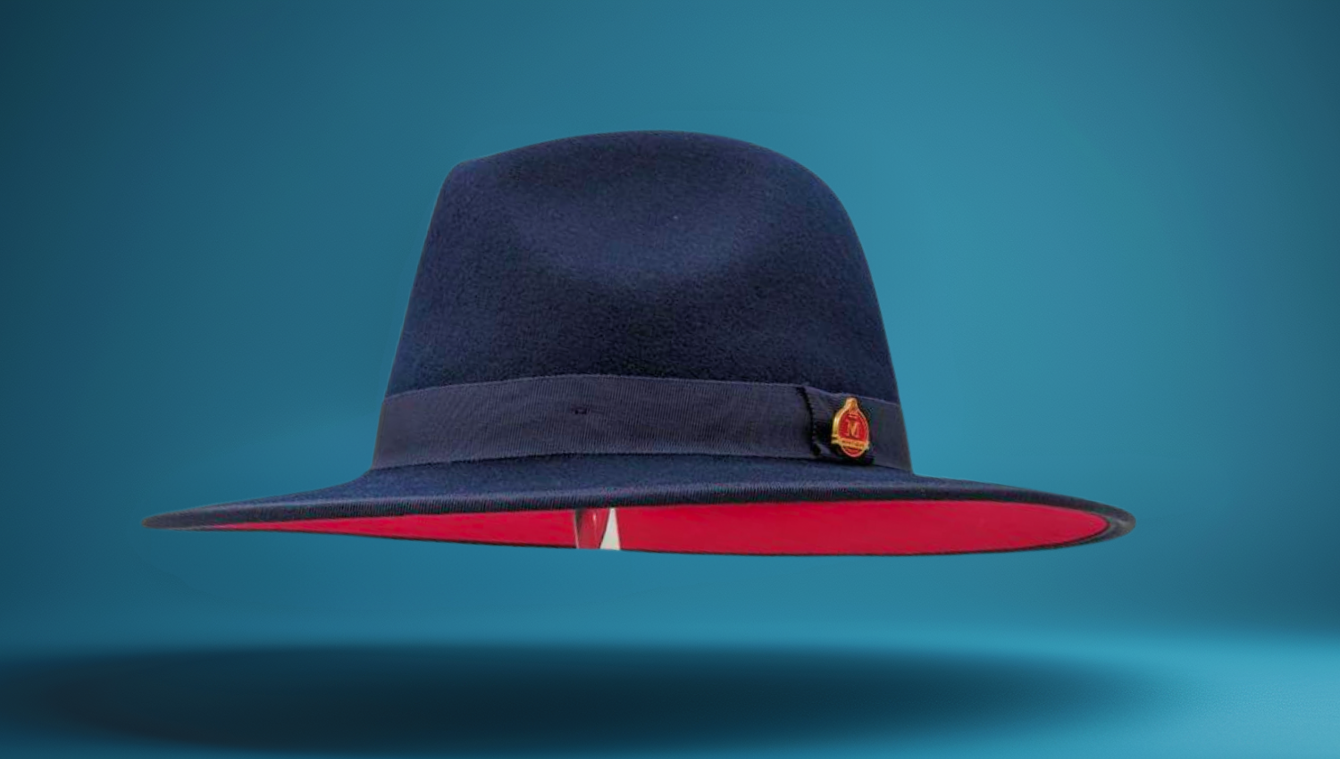 a blue fedora with a red bottom.