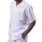 Front view of the white short sleeve men's walking suit shirt and matching pants on model.
