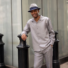 Grey tone-on-tone long sleeve 2-piece walking suit by Montique front view
