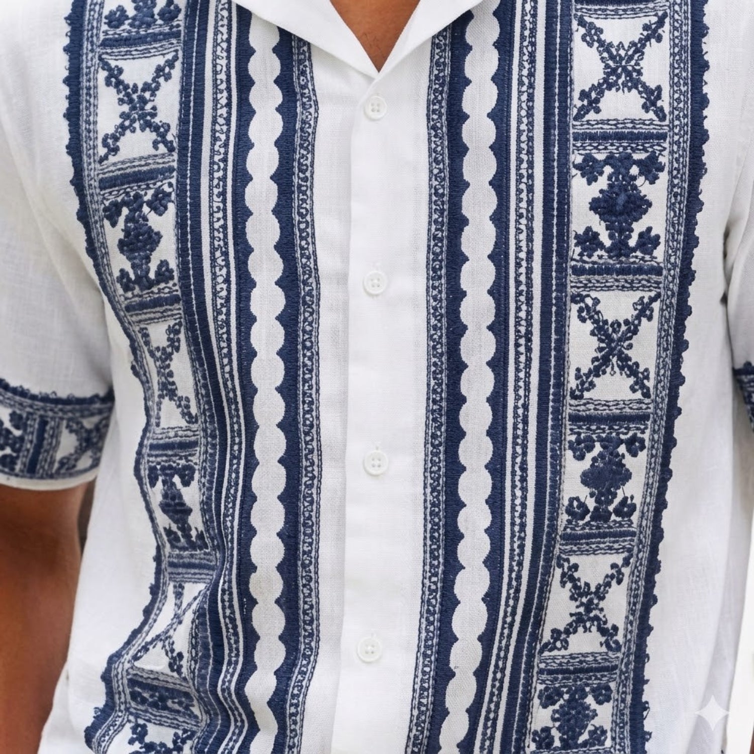 Close-up of white embroidered short sleeve walking suit shirt by Stacy Adams